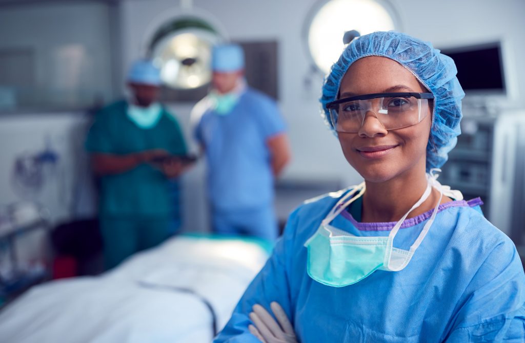 Breast Reduction Recovery and Results in Turkey 2 portrait of female surgeon wearing scrubs and prot HTEEDS8 min
