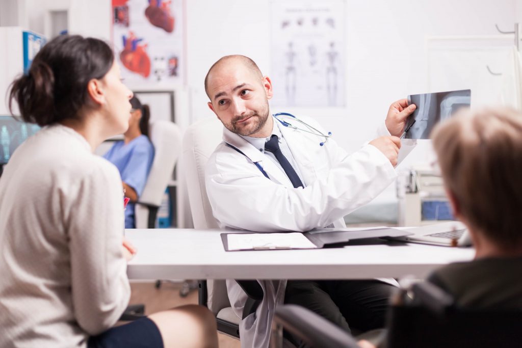 Best Knee Replacement Surgery in Europe - Best Price 4 doctor explaining knee injury TYBNHQQ min