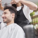 male-customer-looking-on-cutting-hair-XMGQ5D7-min