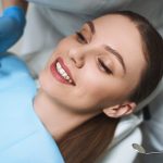 smiling woman in dental chair stock photo 2021 07 06 03 13 08 utc min