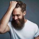 laughing-bearded-man-holding-hair-and-laughing-2021-08-26-17-26-55-utc-min