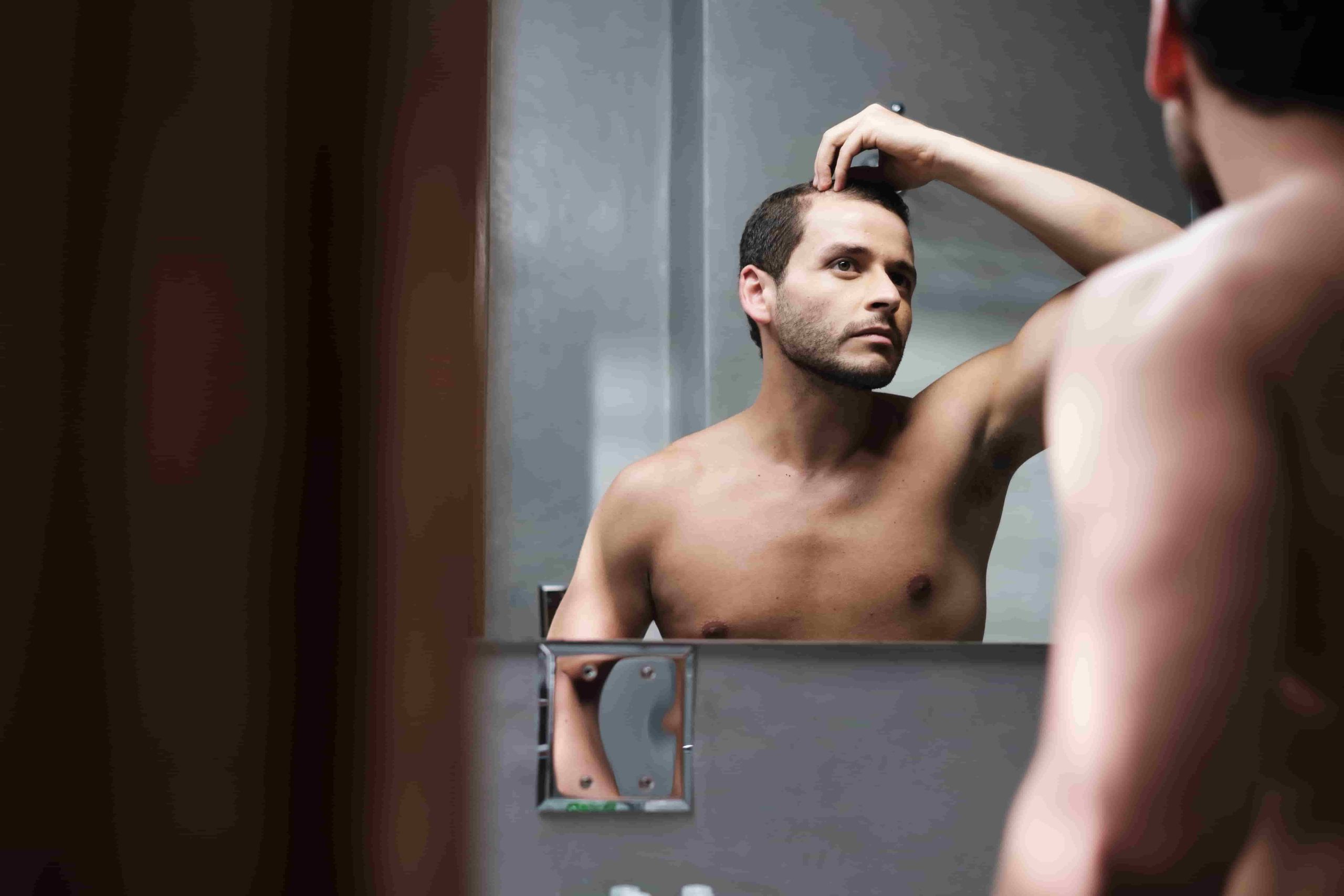 Which Country Is Better In Hair Transplantation, India Vs Turkey? 1 young man in bathroom worried about premature rece 2021 08 28 18 24 57 utc min scaled